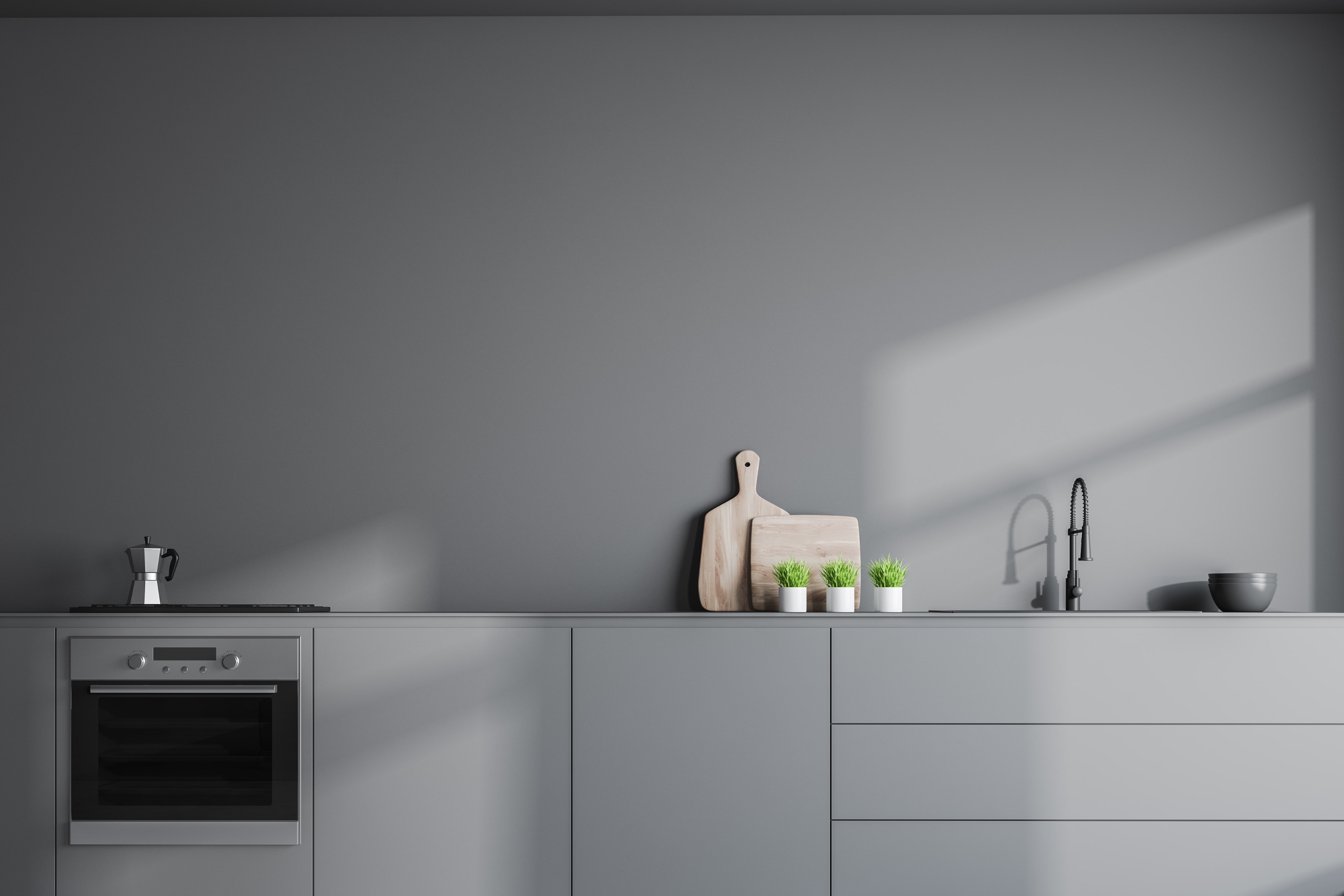 A simple, gray kitchen with very minimal decor